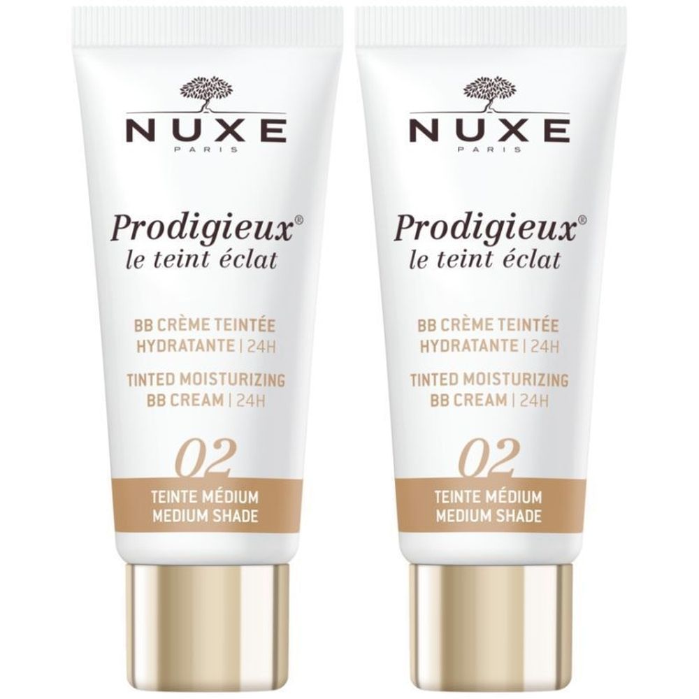 Deux tubes de BB Crème Teintée Hydratante 24h Nuxe Prodigieux. Blanc, accents marron et or. Texte en français et anglais.