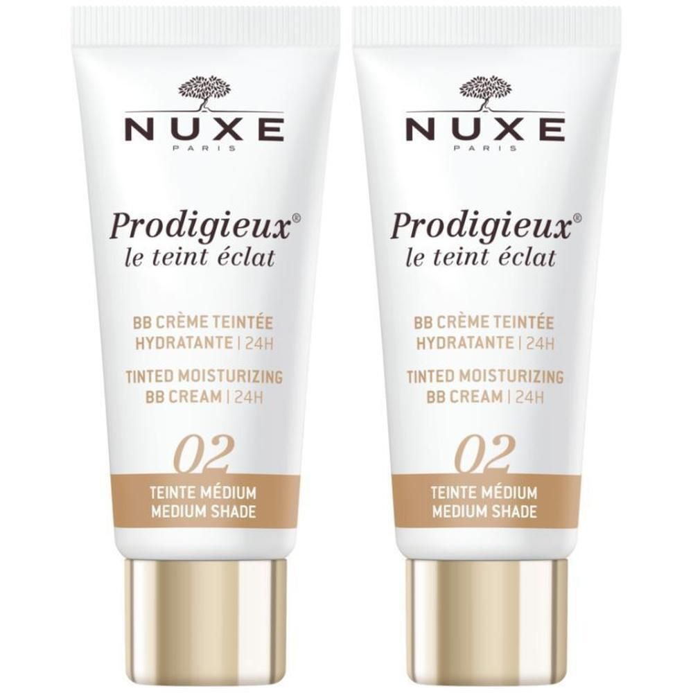 Deux tubes de BB Crème Teintée Hydratante 24h Nuxe Prodigieux. Blanc, accents marron et or. Texte en français et anglais.