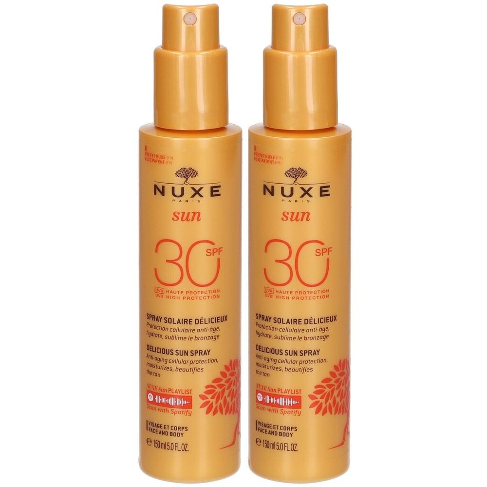 Deux flacons de spray solaire NUXE Sun SPF30. Étiquette jaune avec texte: Spray Solaire Délicieux. Bouteilles avec vaporisateur.