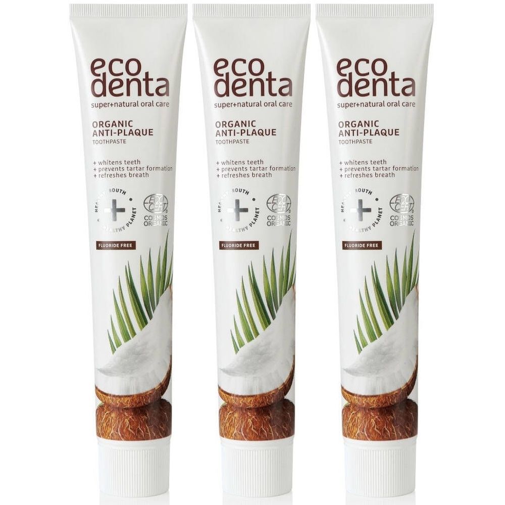 Trois tubes de dentifrice. Inscription: Ecodenta Organic Anti-Plaque. Illustration de noix de coco. Sans fluor.