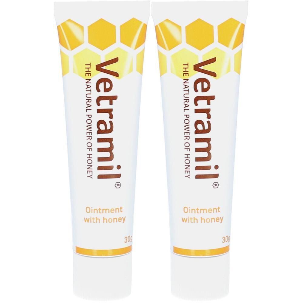 Deux tubes de Vetramil® Onguent au miel. Tubes blancs avec motif nid d'abeilles jaune et texte.