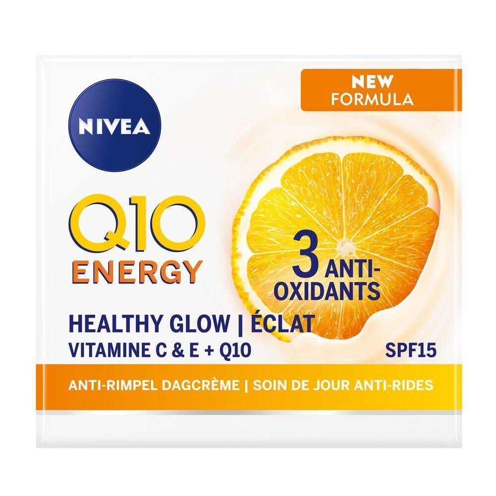 Emballage blanc avec logo NIVEA et inscription jaune Q10 ENERGY. Image d'une tranche d'orange. Texte Healthy Glow, 3 antioxydants, SPF15.