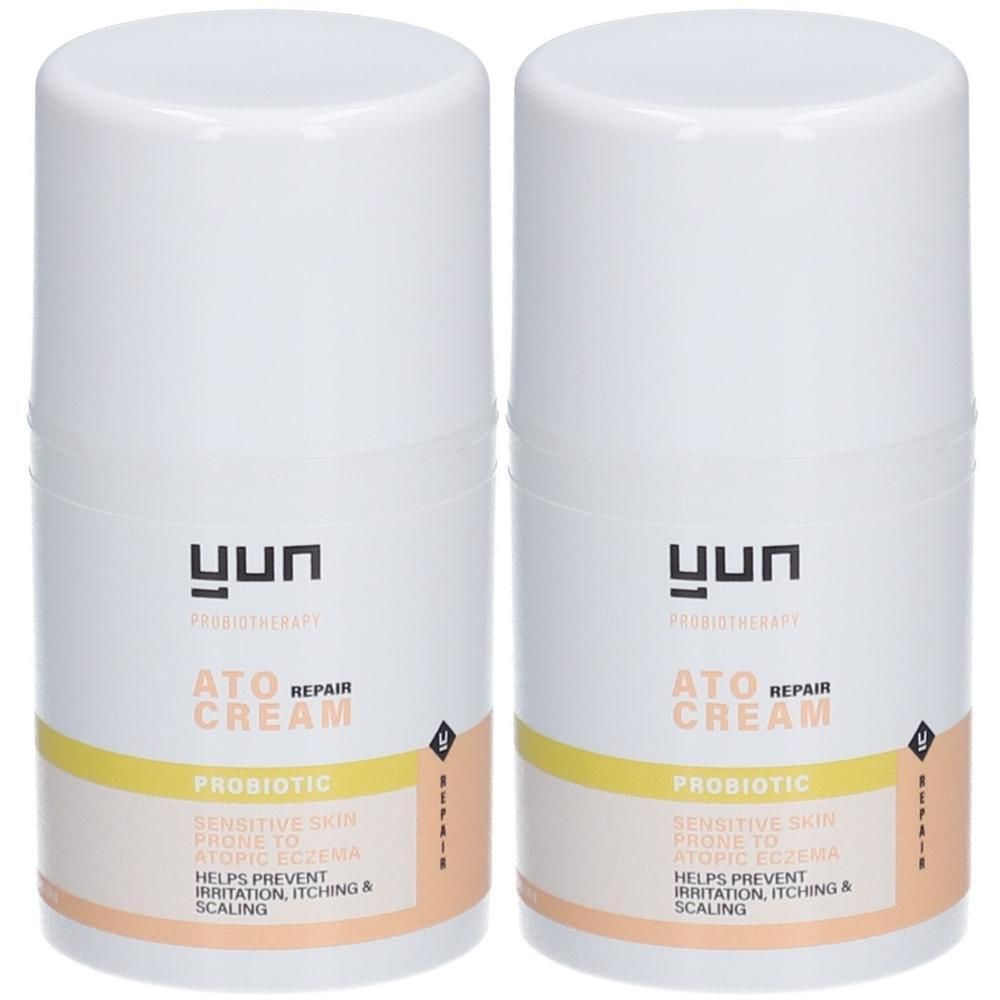 Deux tubes de crème blancs avec bande jaune et texte. ATO REPAIR CREAM, PROBIOTIC. Aide à prévenir l'irritation, les démangeaisons et la desquamation.