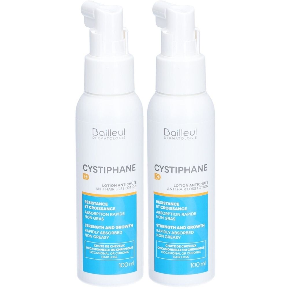 Deux flacons blancs avec pompe. Inscription Cystiphane, Lotion Antichute. Étiquettes bleues et jaunes.