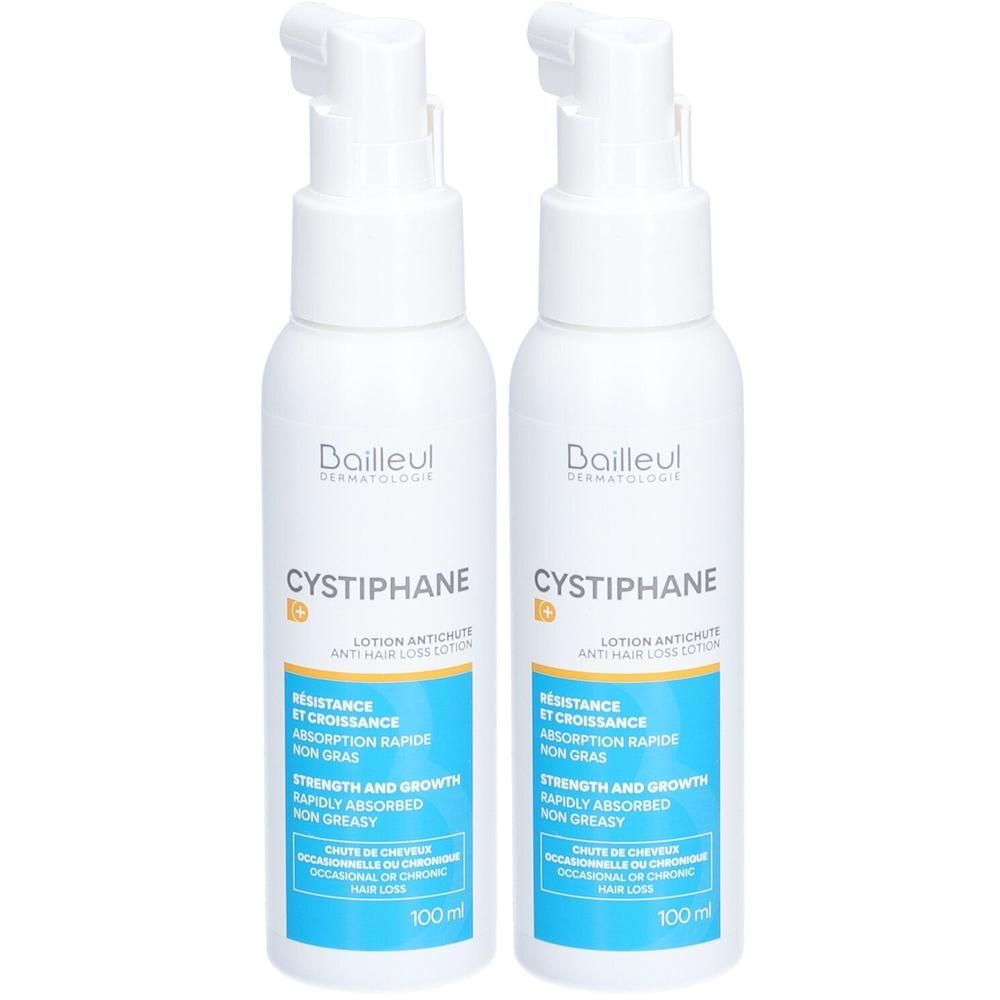 Deux flacons blancs avec pompe. Inscription Cystiphane, Lotion Antichute. Étiquettes bleues et jaunes.