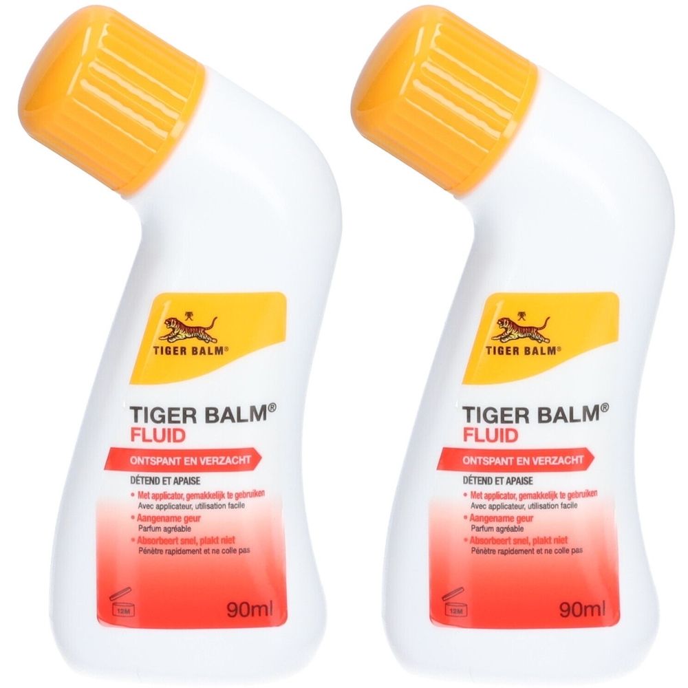 Deux flacons de Tiger Balm® Fluid. Flacons blancs avec bouchons jaunes. Inscriptions rouges et jaunes. 90ml.