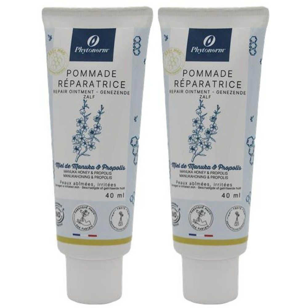 Deux tubes de crème. Inscription: POMMADE RÉPARATRICE, 40 ml. Contient du miel de Manuka et de la propolis. Marque: Phytonorm.