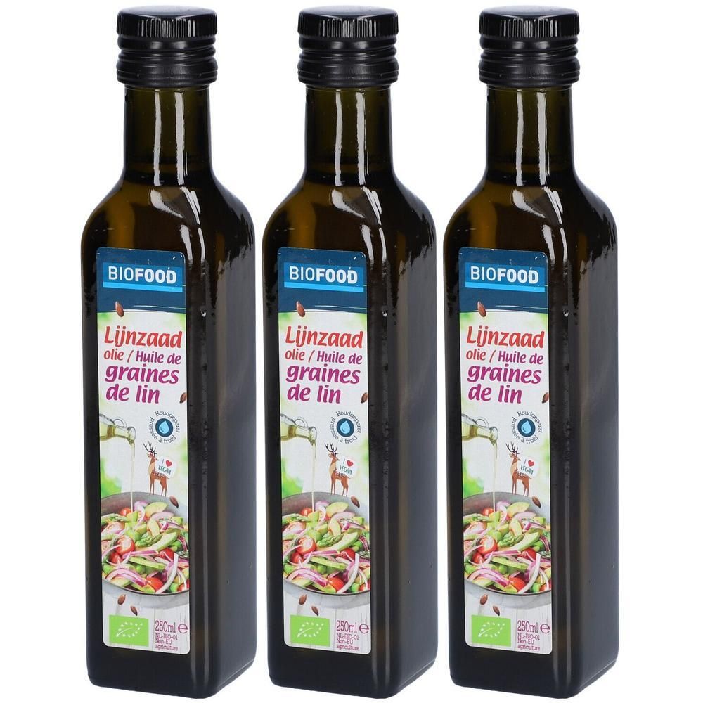 Trois bouteilles de BIOFOOD L'Huile de lin. Bouteilles en verre vert foncé avec bouchon noir et étiquette. Inscription : Lijnzaad olie/Huile de graines de lin.