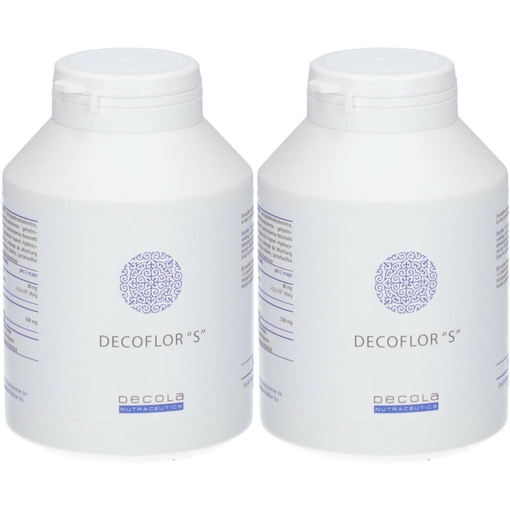 Deux flacons blancs avec couvercles. Inscription: Decoflor "S" et Decola Nutraceutics. Étiquettes avec texte.