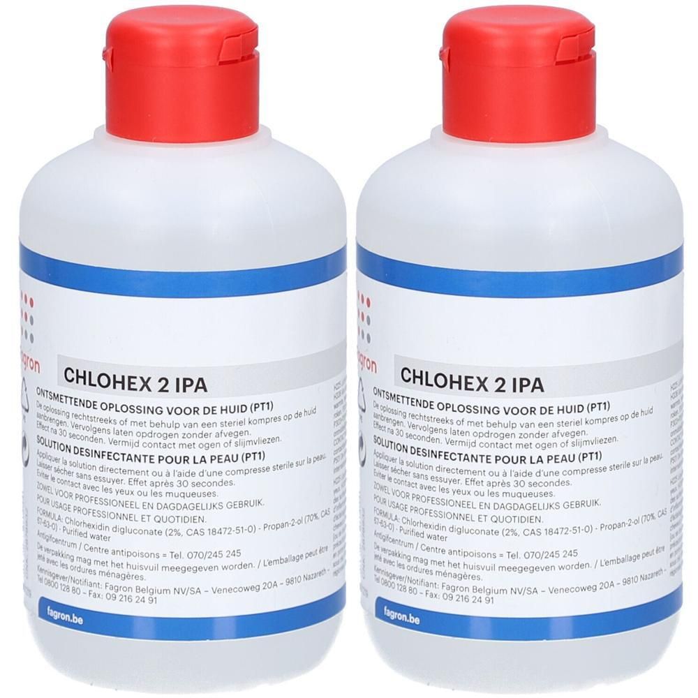 Deux flacons de PHARMAWHITE® CHLOHEX 2 IPA. Flacons blancs avec bouchon rouge. Inscription bleue. Texte: CHLOHEX 2 IPA.