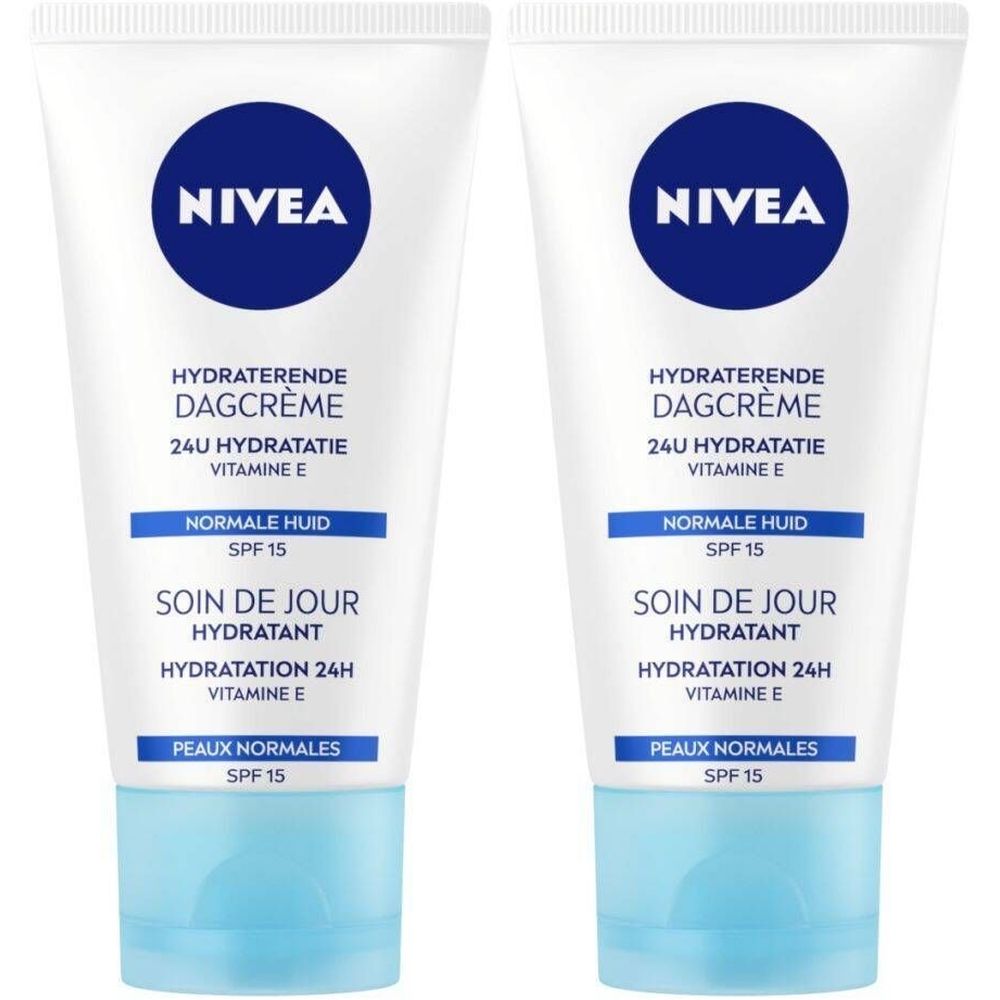 Deux tubes de NIVEA Soin de Jour Hydratant SPF15. Tubes blancs avec bouchon bleu et logo. Texte: Hydratation 24H, Vitamine E, Peaux Normales.