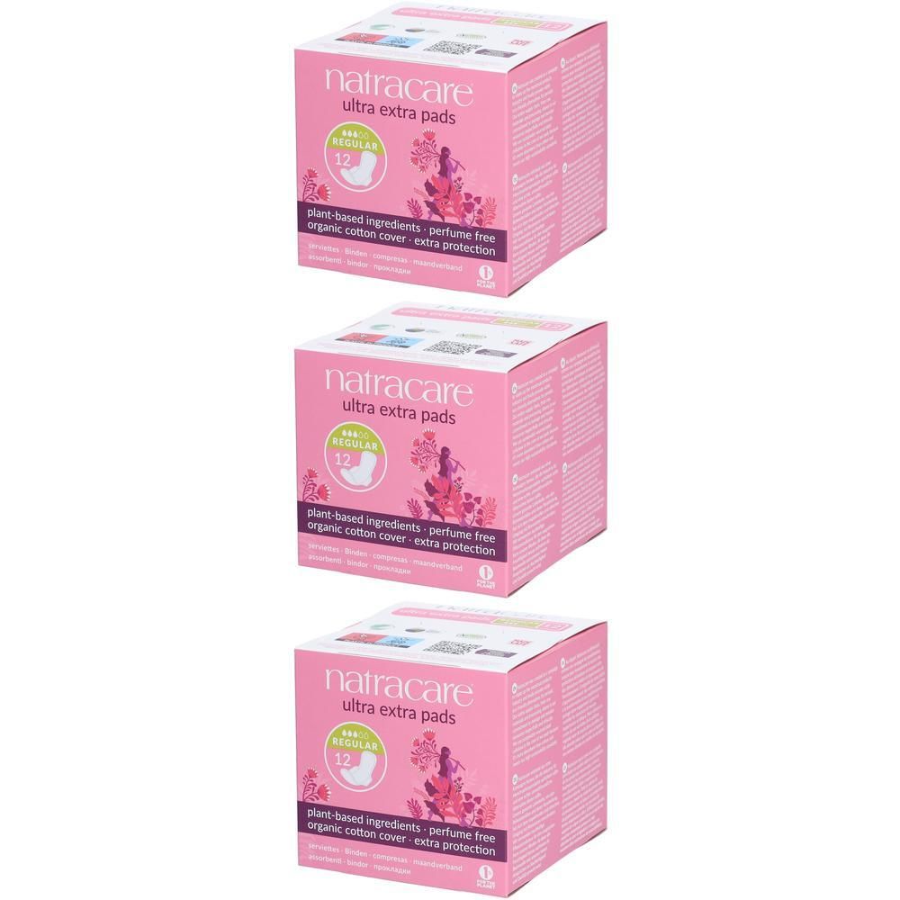 Trois boîtes roses de serviettes Natracare Ultra Extra. Inscription : 12 pièces, ingrédients végétaux, sans parfum, coton bio.
