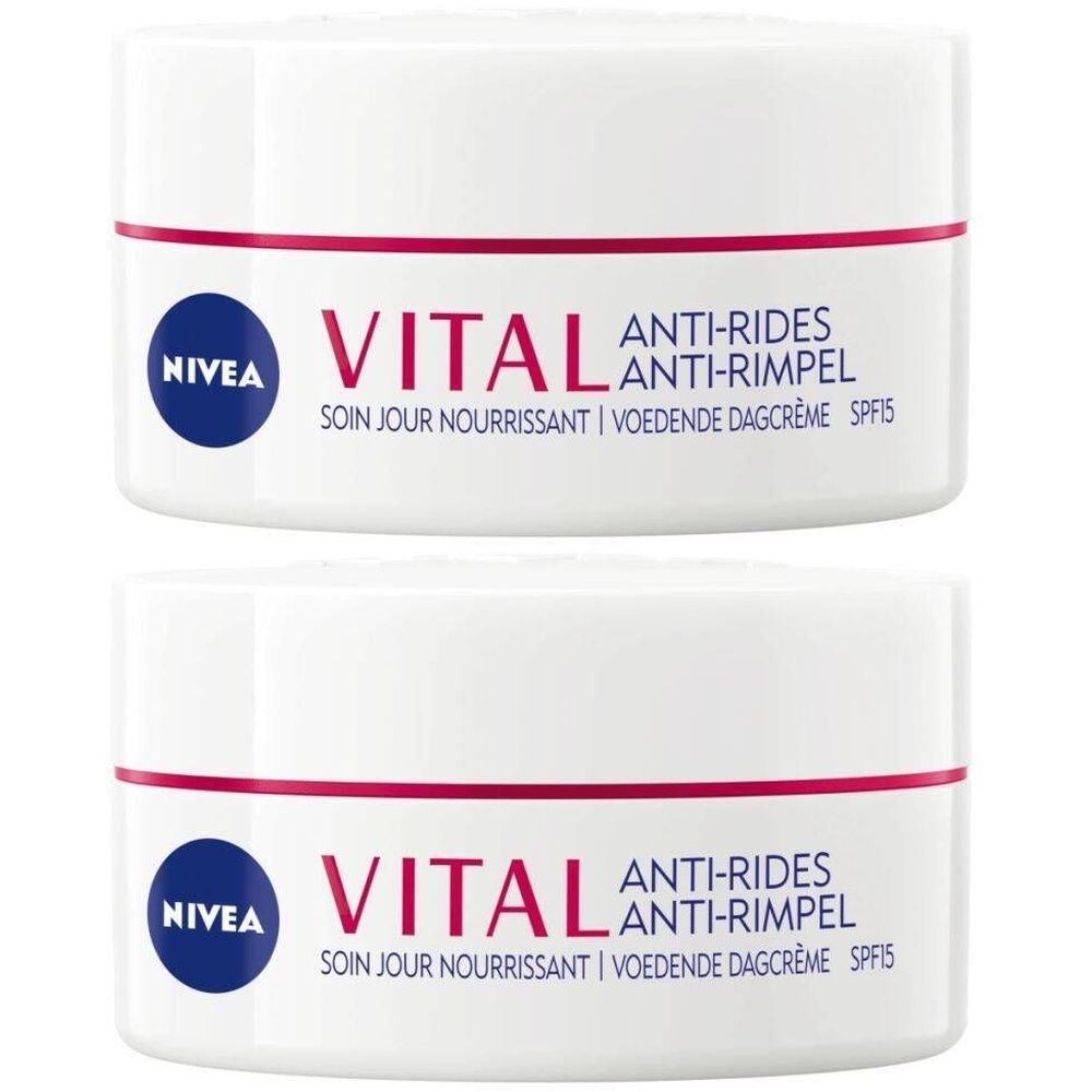 Deux pots blancs avec lettrage rouge et bleu. Inscription: NIVEA VITAL Anti-Rides Soin de Jour Ultra Nourrissant SPF15.