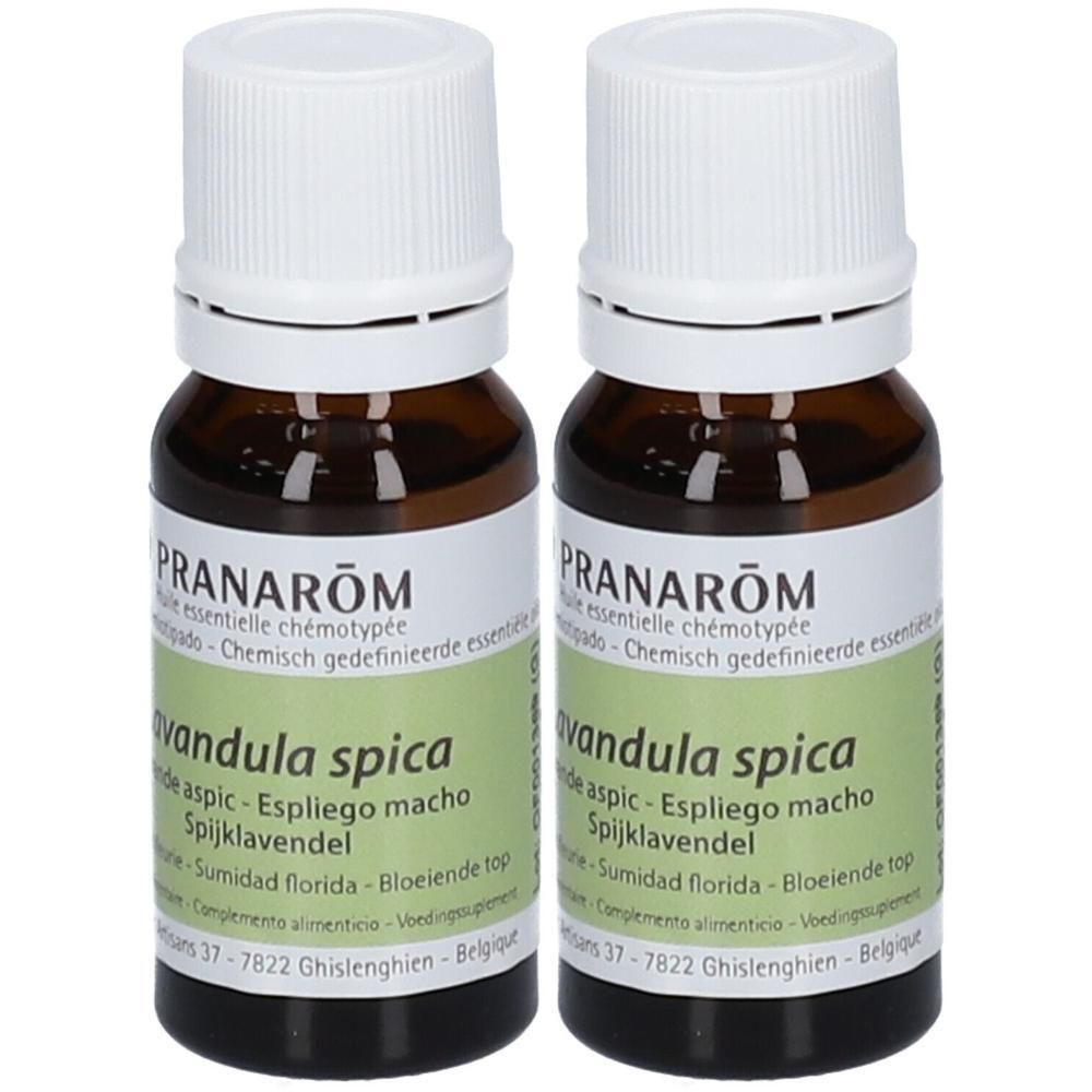 Deux flacons en verre brun, bouchons blancs. Étiquettes avec informations produit. Marque : Pranarôm.