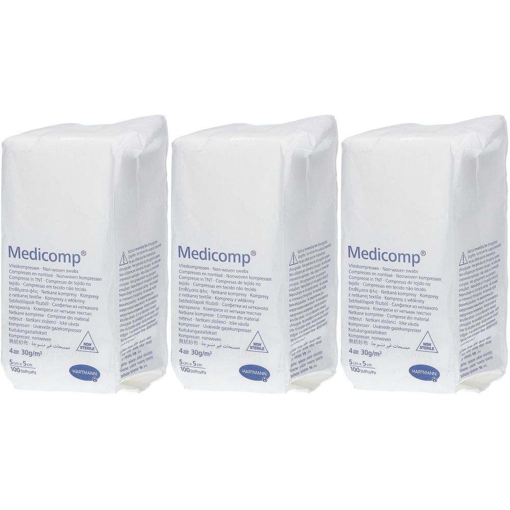 Trois emballages blancs avec l'inscription "Medicomp". Chaque emballage présente des informations et un logo.