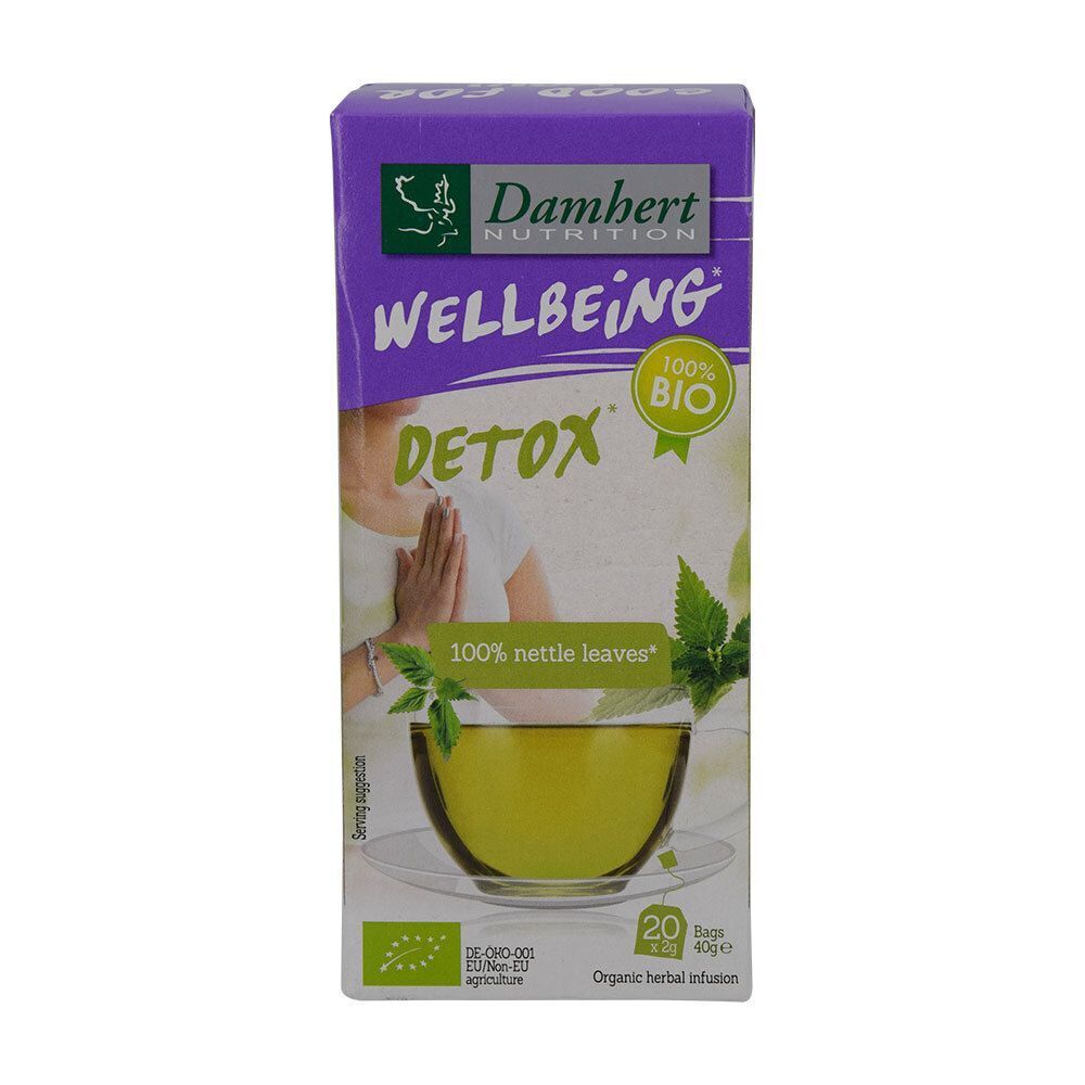 Emballage de thé Damhert Wellbeing Detox. Montre une tasse de thé aux feuilles d'ortie et le label bio.