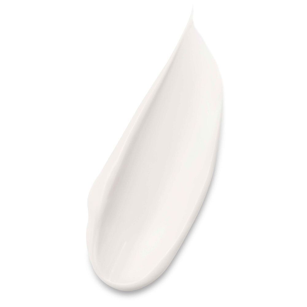 Gros plan d'une goutte de crème. Crème blanche, forme allongée.