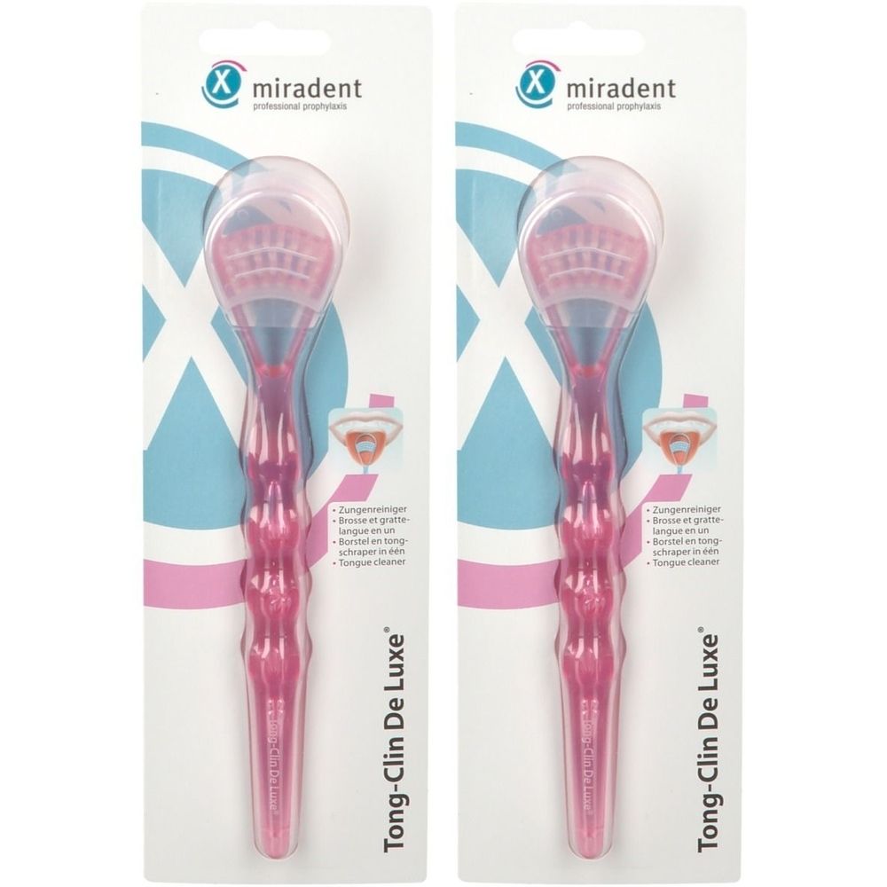 Deux gratte-langues roses dans un emballage blister. Visibles: manche, racloir, soies et nom du produit.