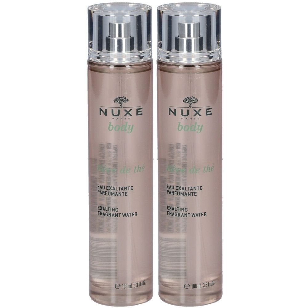 Deux flacons NUXE Body Rêve de thé. Vaporisateurs argentés. Inscription: Eau exaltante parfumante.