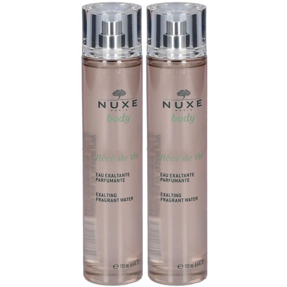 Deux flacons NUXE Body Rêve de thé. Vaporisateurs argentés. Inscription: Eau exaltante parfumante.