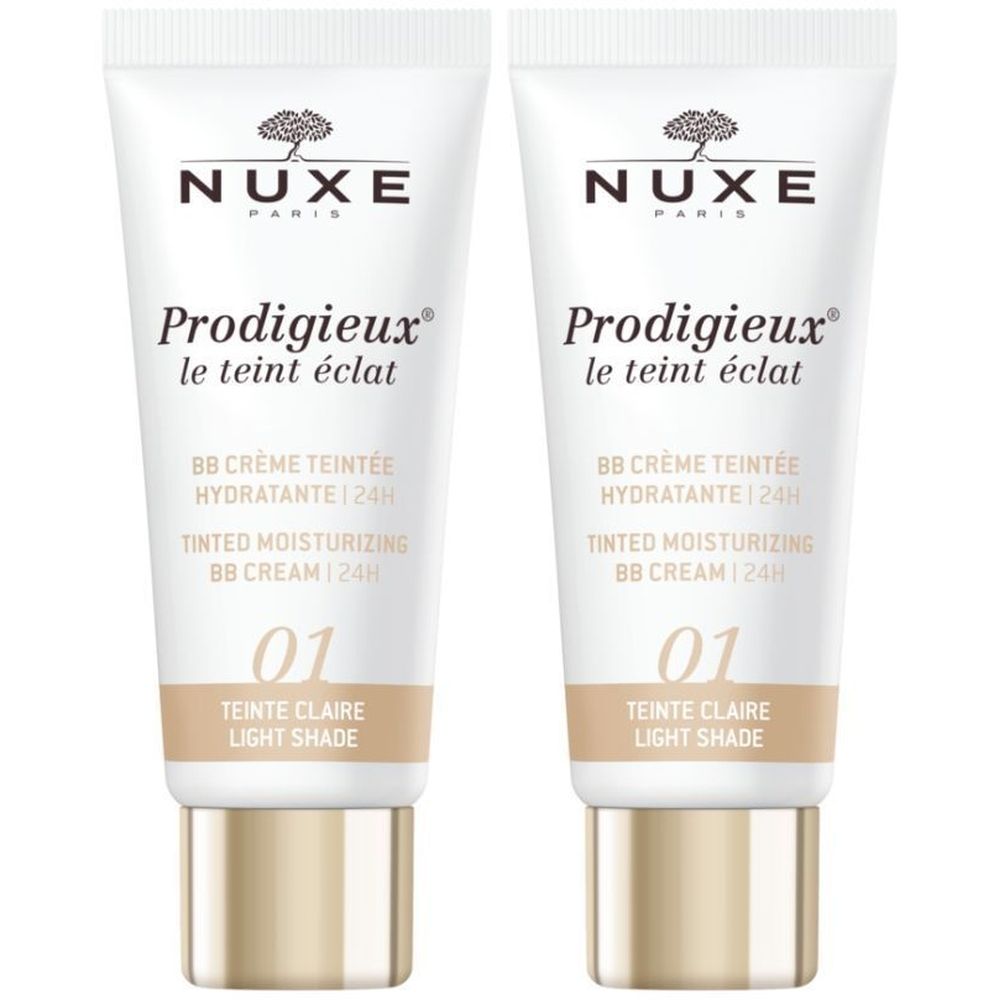 Deux tubes de Nuxe Prodigieux BB Crème Teintée Hydratante 24h. Inscription : 01 Teinte Claire. Tube blanc, bouchon doré.