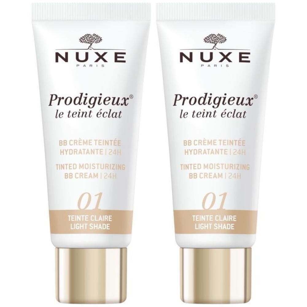 Deux tubes de Nuxe Prodigieux BB Crème Teintée Hydratante 24h. Inscription : 01 Teinte Claire. Tube blanc, bouchon doré.