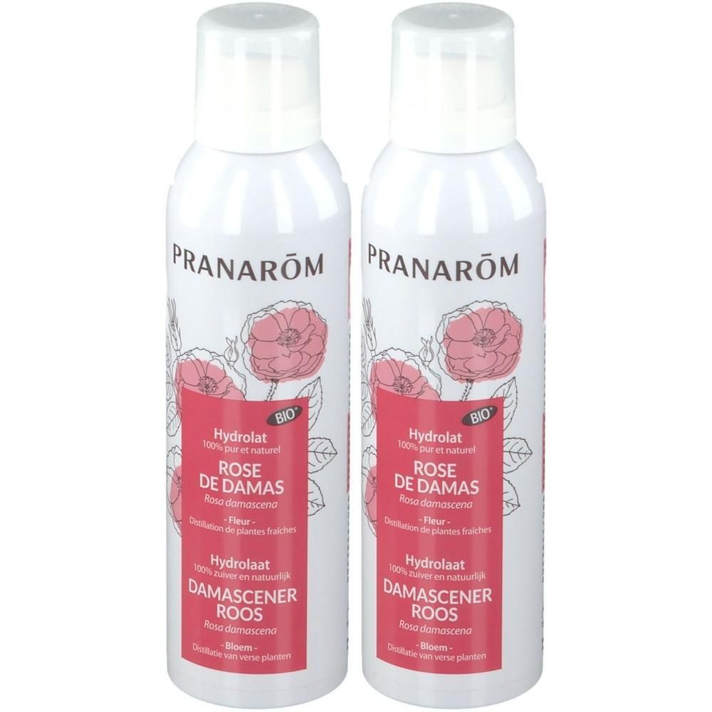 Deux flacons spray blancs avec étiquette rose et motif floral. Texte: Pranarôm, Hydrolat Rose de Damas, Bio.