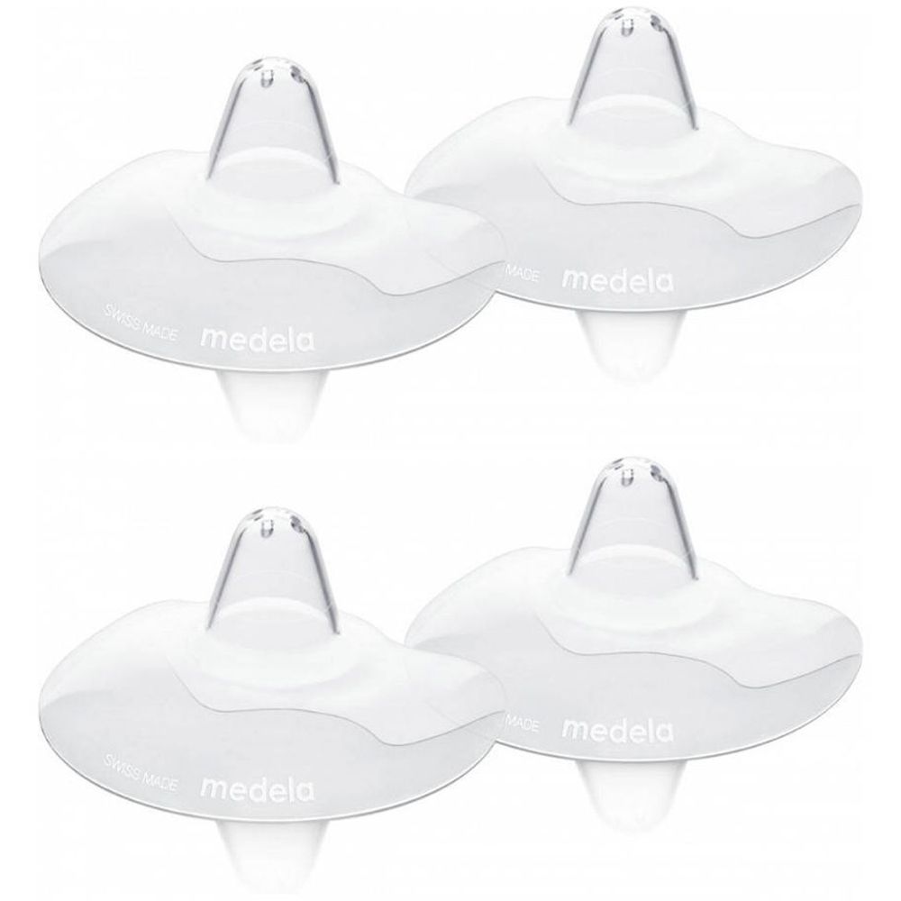 Quatre bouts de sein blancs et transparents. Marque: medela. En silicone. Forme arrondie avec trou central.