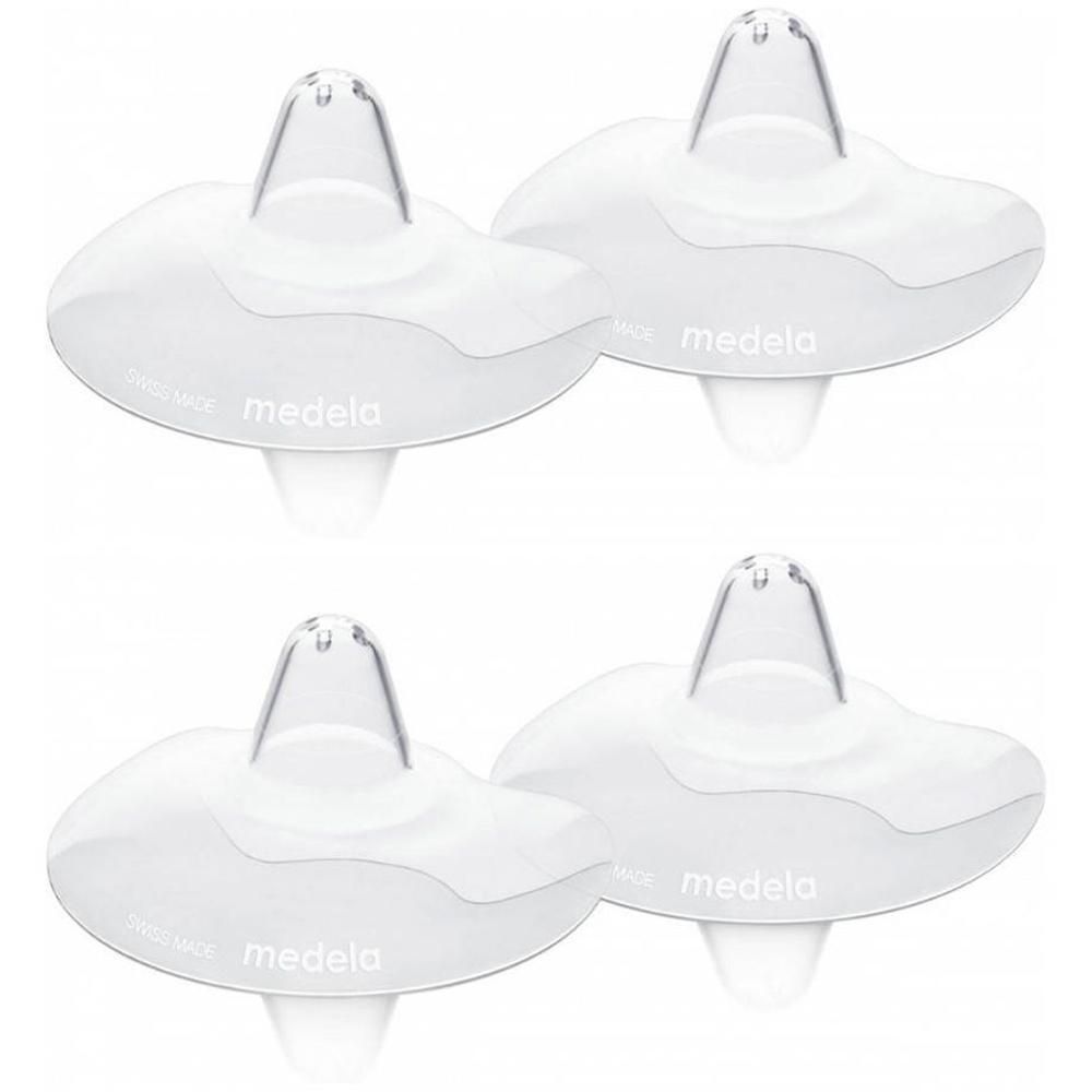 Quatre bouts de sein blancs et transparents. Marque: medela. En silicone. Forme arrondie avec trou central.