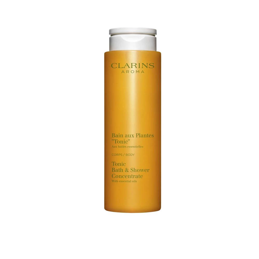 Concentré Bain & Douche Tonic Clarins dans une bouteille jaune avec un bouchon rabattable blanc.