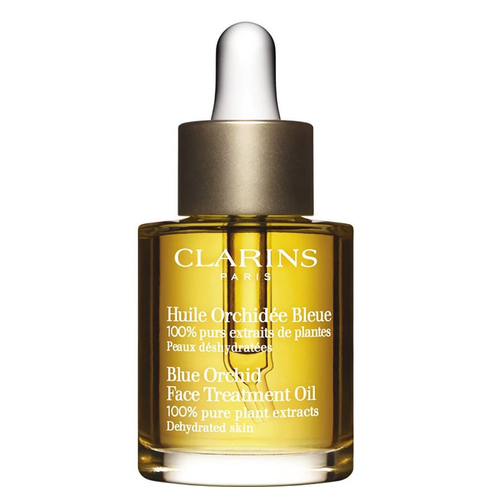 Huile Visage Orchidée Bleue Clarins, flacon en verre avec pipette, bouchon doré.