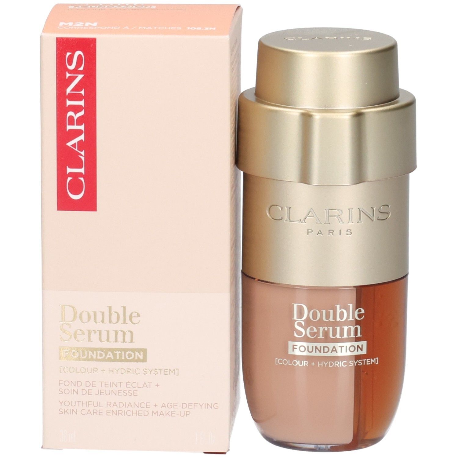 Clarins Double Serum Foundation M2N : flacon pompe doré à deux compartiments, l'un avec fond de teint beige, l'autre avec sérum brun doré.