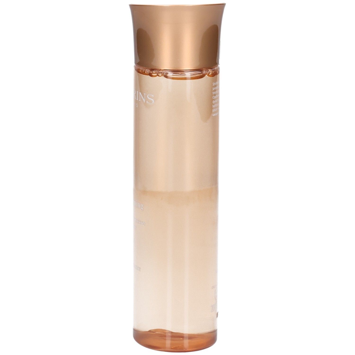 Essence Clarins Extra-Firming : vue latérale d'un flacon à bouchon doré et liquide pêche.