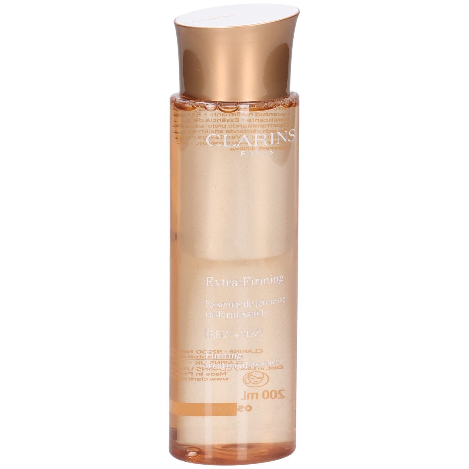 Essence Clarins Extra-Firming : flacon à bouchon doré et liquide pêche.