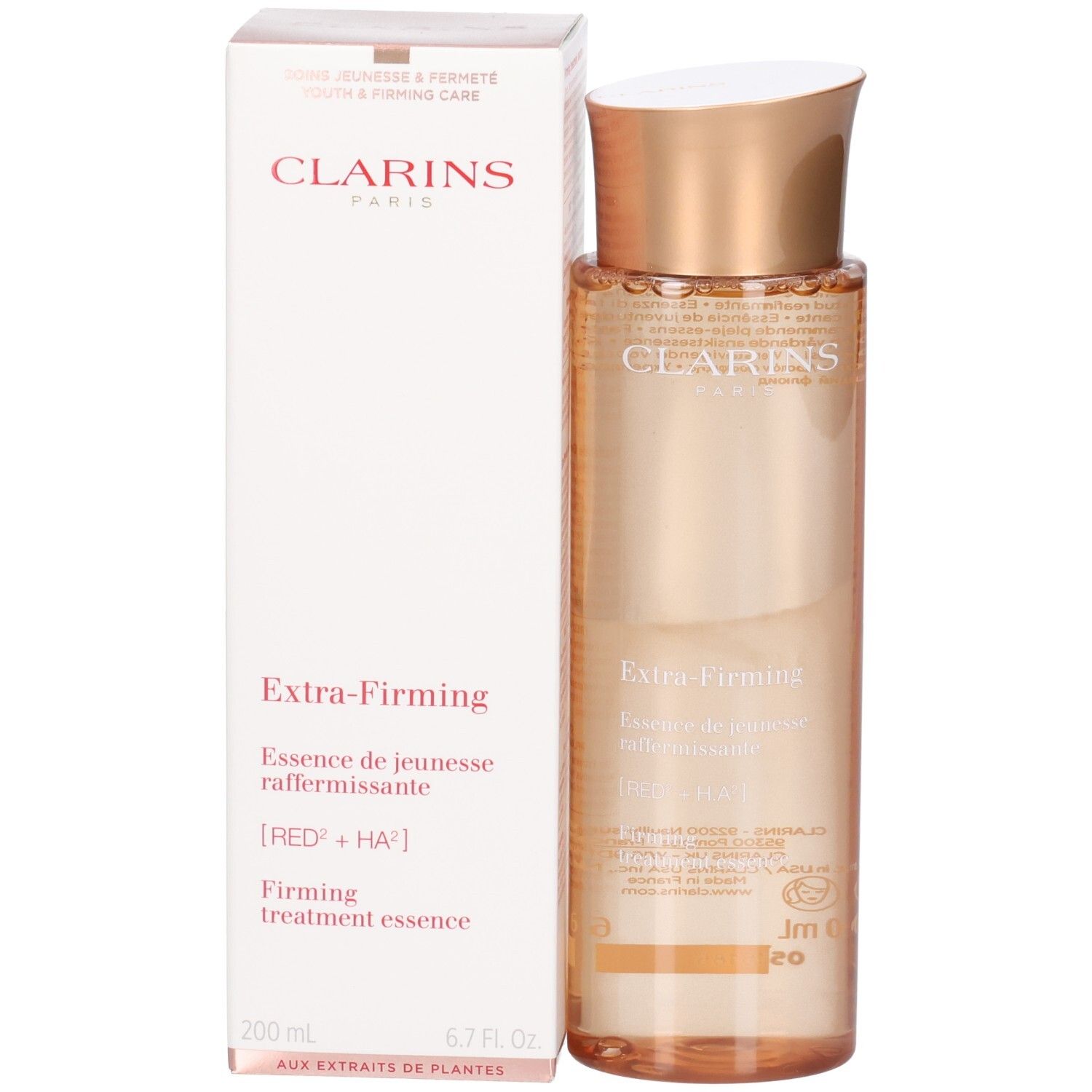 Essence Clarins Extra-Firming : flacon et boîte avec bouchon doré et liquide pêche.