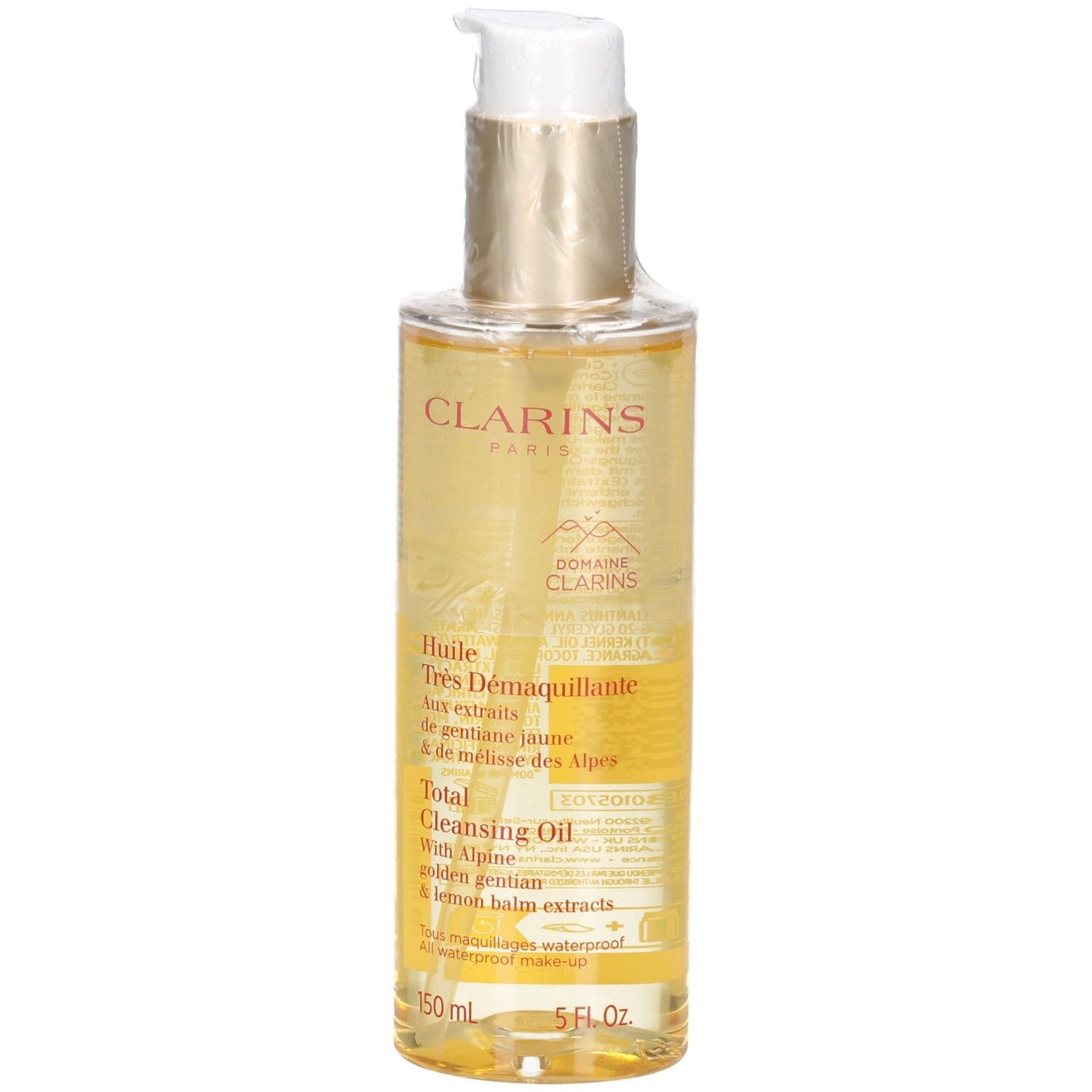 Huile démaquillante Clarins : liquide doré dans flacon pompe avec étiquette.
