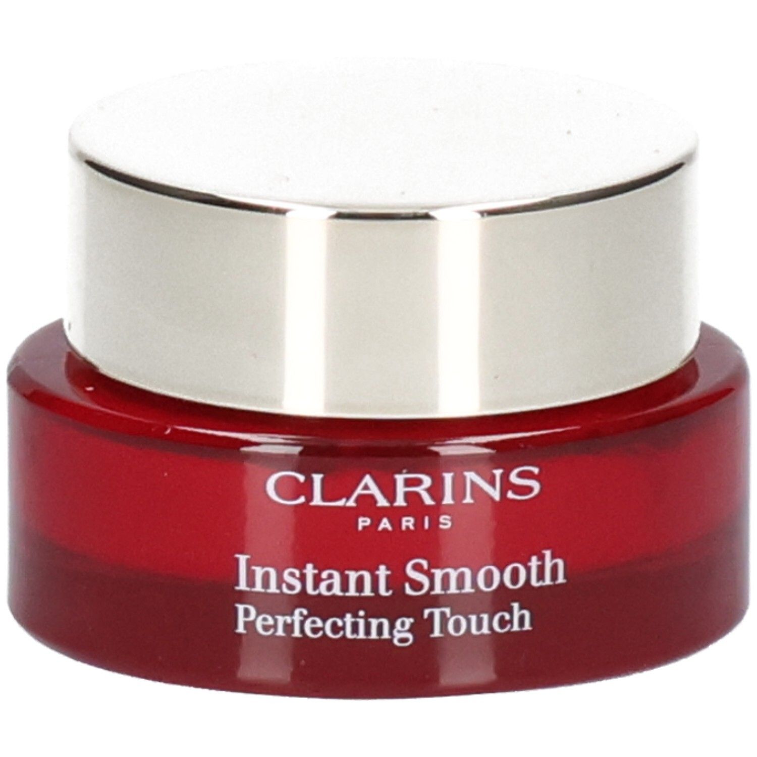 Pot Clarins Instant Smooth Perfecting Touch, base en verre rouge, couvercle argenté.