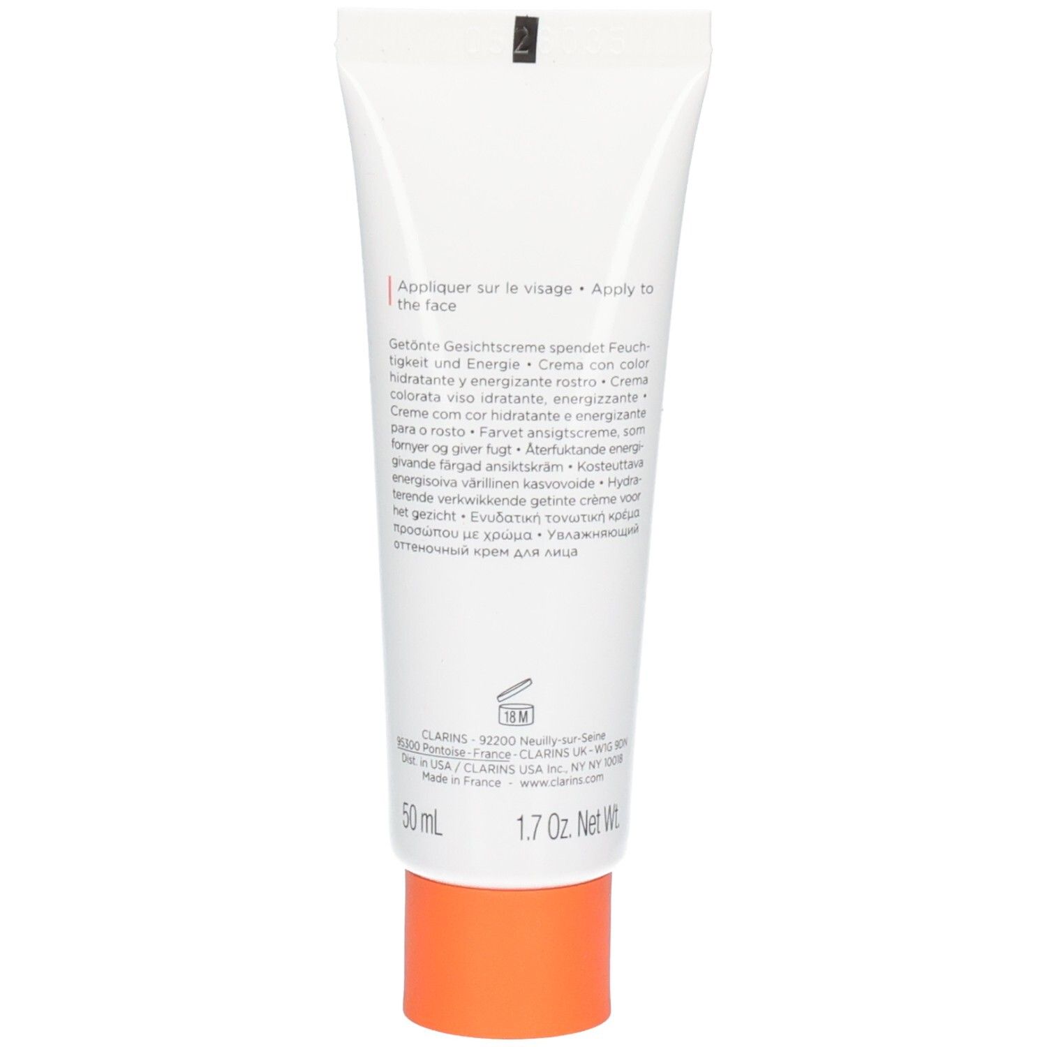Arrière d'un tube blanc avec informations produit et bouchon orange.