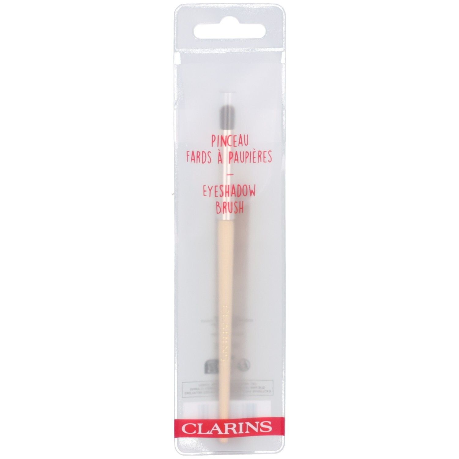 Pinceau fards à paupières Clarins sous emballage transparent.
