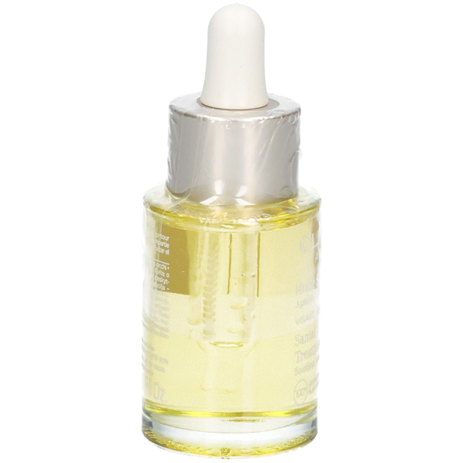 Flacon en verre avec pipette, rempli d'huile visage jaune.