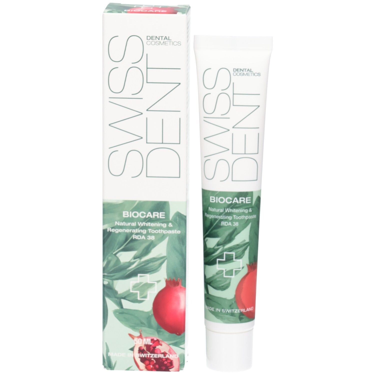 Tube et boîte de dentifrice. Inscription SWISSDENT et BIOCARE. Illustration de grenade. Design vert et blanc.