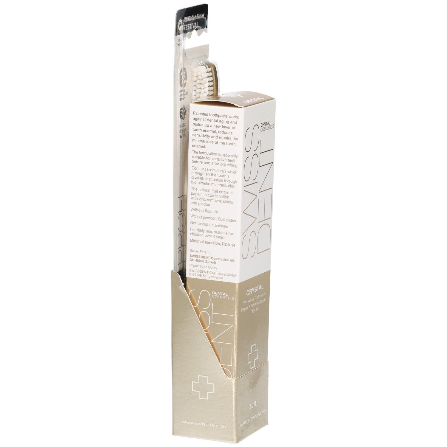 Pack de brosse à dents et dentifrice. Emballage doré avec logo SWISSDENT et inscription Crystal. Texte sur la brosse à dents.
