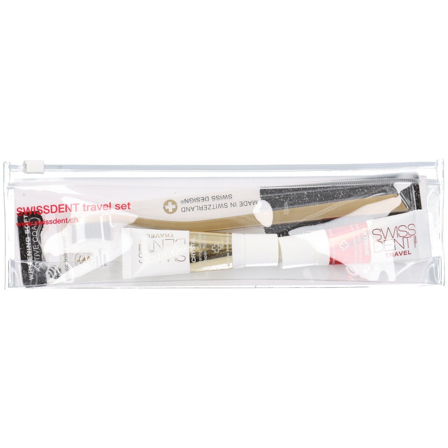 Trousse de voyage transparente. Contient des tubes de dentifrice, une brosse à dents et des accessoires. Inscription : SWISSDENT.