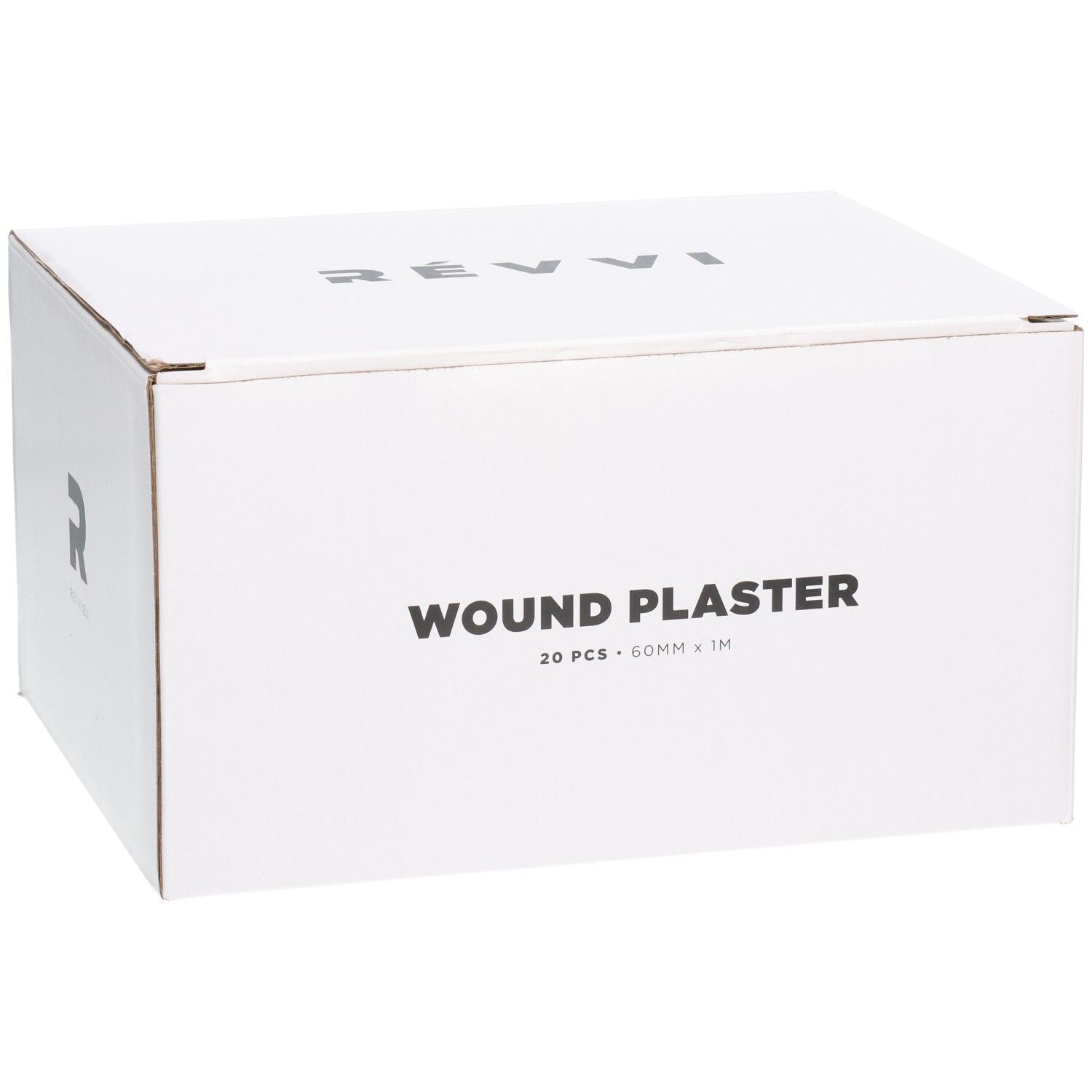 Boîte blanche avec l'inscription WOUND PLASTER, 20 pièces, 60mm x 1M. Sur le côté: RÉVVI.