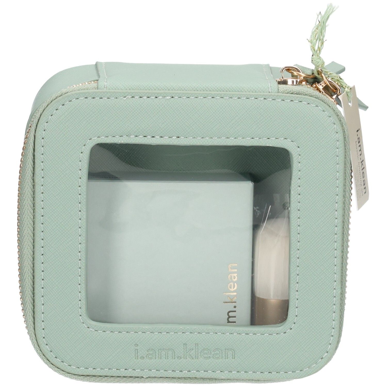 Trousse de maquillage vert clair avec fermeture éclair et fenêtre. Contient une poudre et un pinceau. Label : i.am.klean.