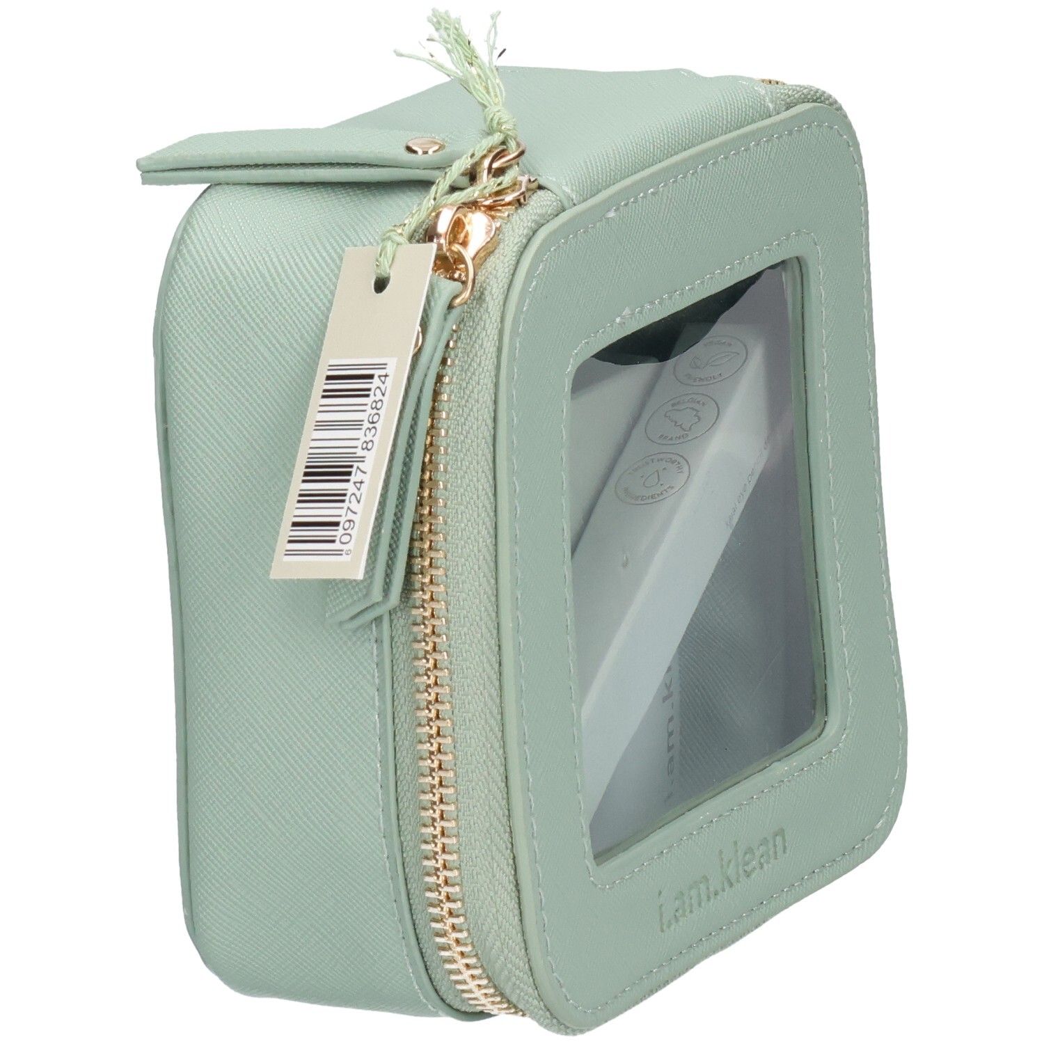 Trousse de toilette verte avec fenêtre transparente, fermeture éclair et étiquette. Contient un produit blanc.