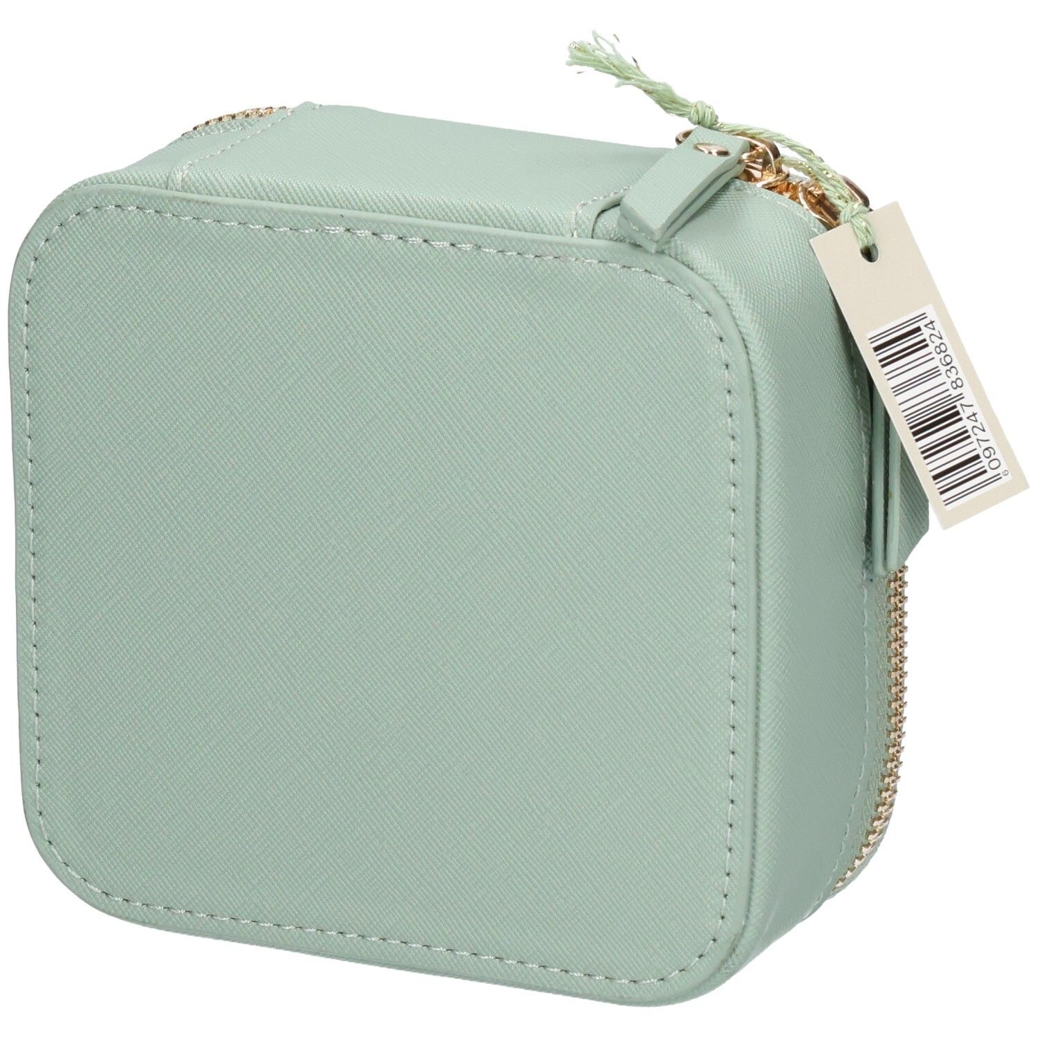 Arrière d'une trousse de toilette verte avec fenêtre transparente et fermeture éclair. Contient un produit blanc.
