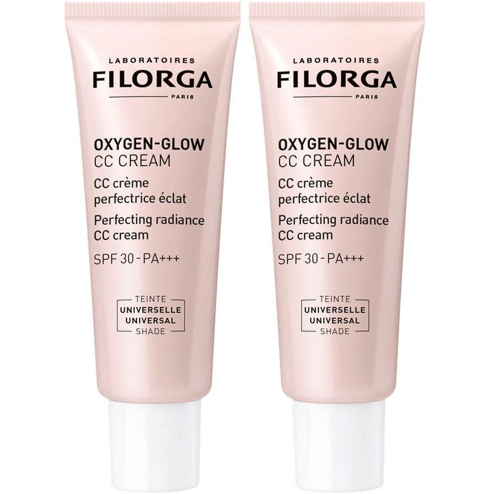Deux tubes de FILORGA Oxygen-Glow CC Crème. Tube rose, nom et détails du produit en noir. SPF30-PA+++.