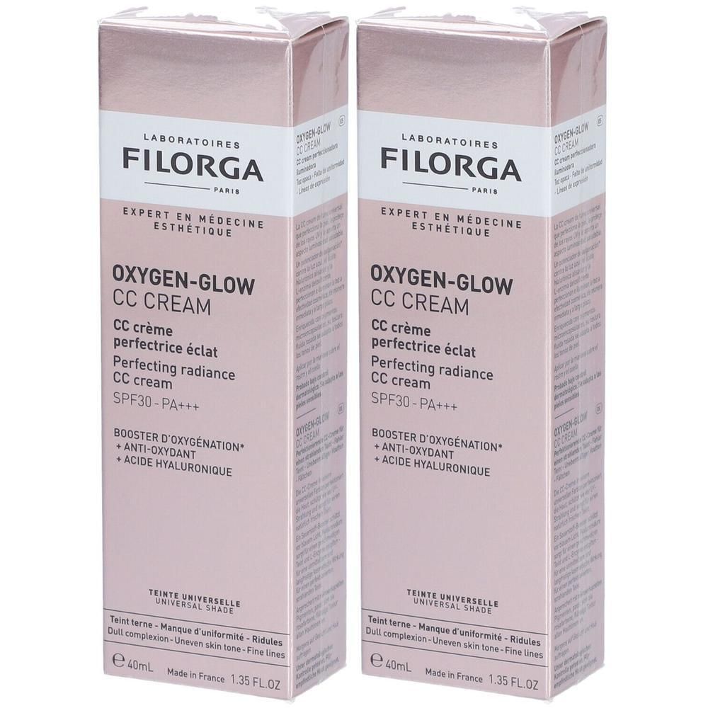 Deux boîtes de FILORGA Oxygen-Glow CC Crème. Emballage rose, nom et détails du produit en noir et blanc. SPF30-PA+++.