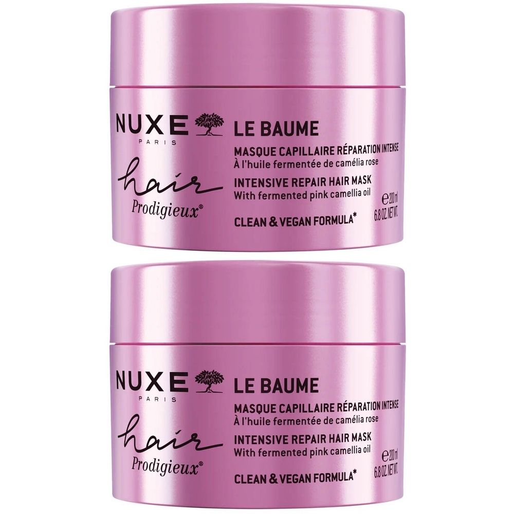 Deux pots roses. Inscription: Nuxe Hair Prodigieux, Le Baume, Masque capillaire réparation intense. Vegan.
